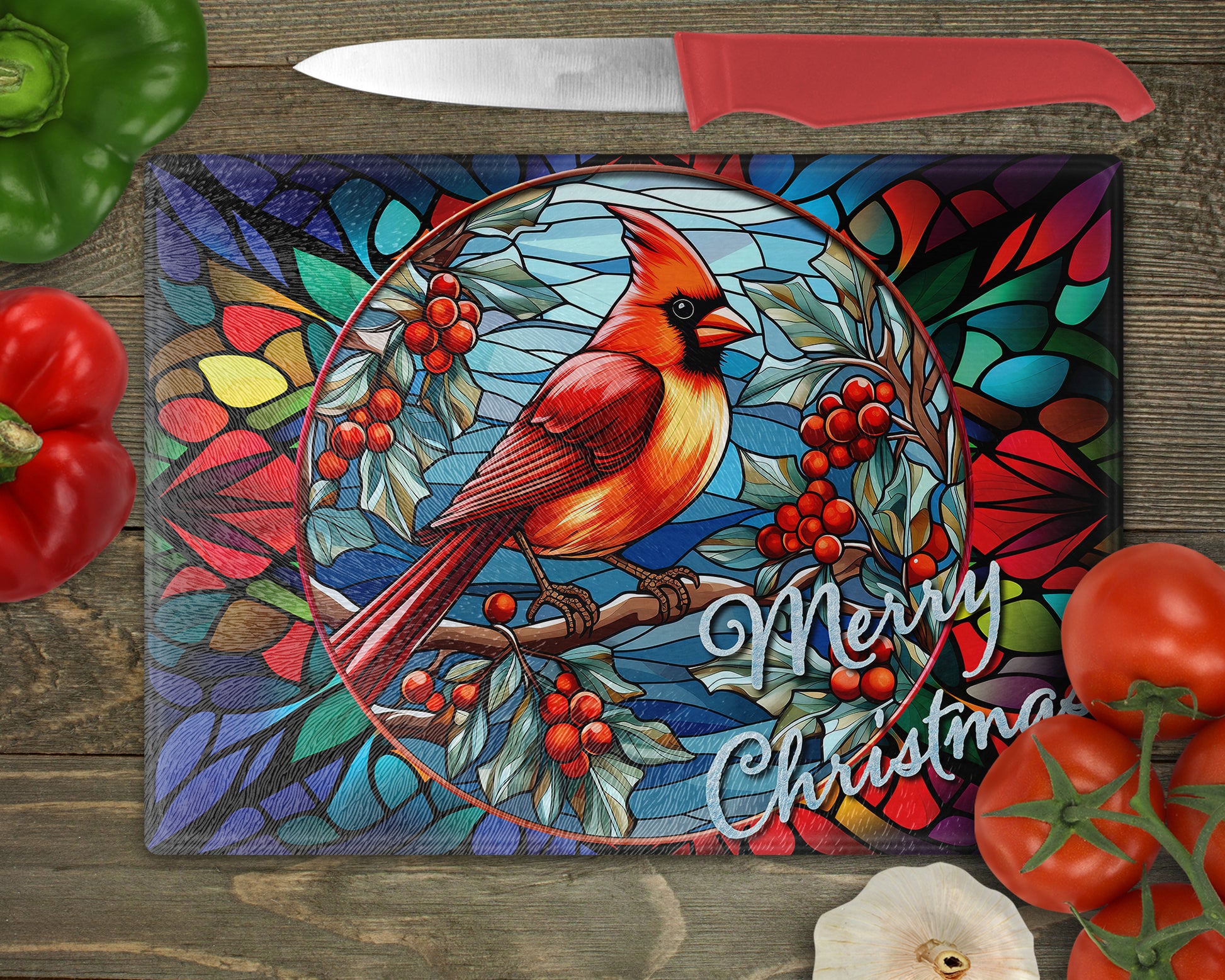 a stained glass cutting board with a cardinal on it