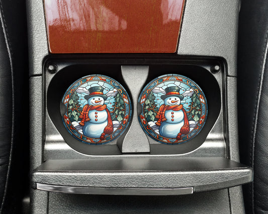 a pair of snowmen painted on the front of a car