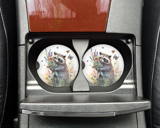 a car seat with two plates with a picture of a raccoon