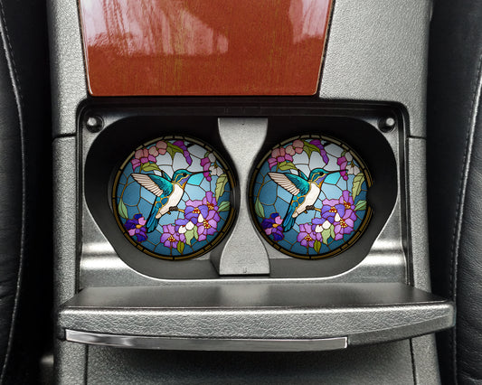 two round stained glass windows in the center console of a car