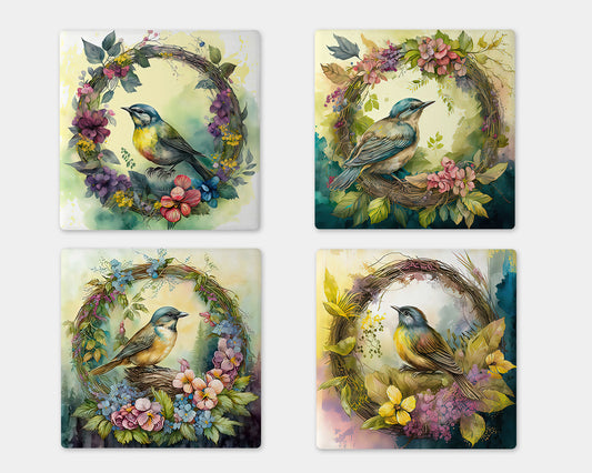 a set of four coasters with birds on them