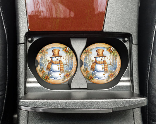 a pair of snowman plates sitting on top of a car seat
